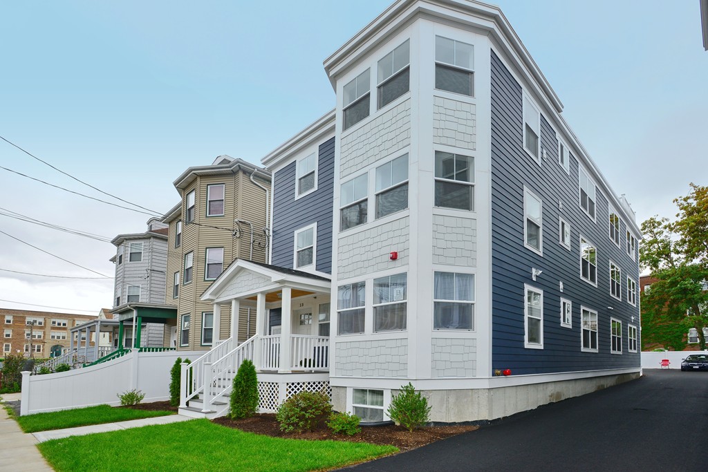 11 Ruthven Street, Unit 1 Boston, MA 02121 - Photo 1 of 1 a front view of a building with garden
