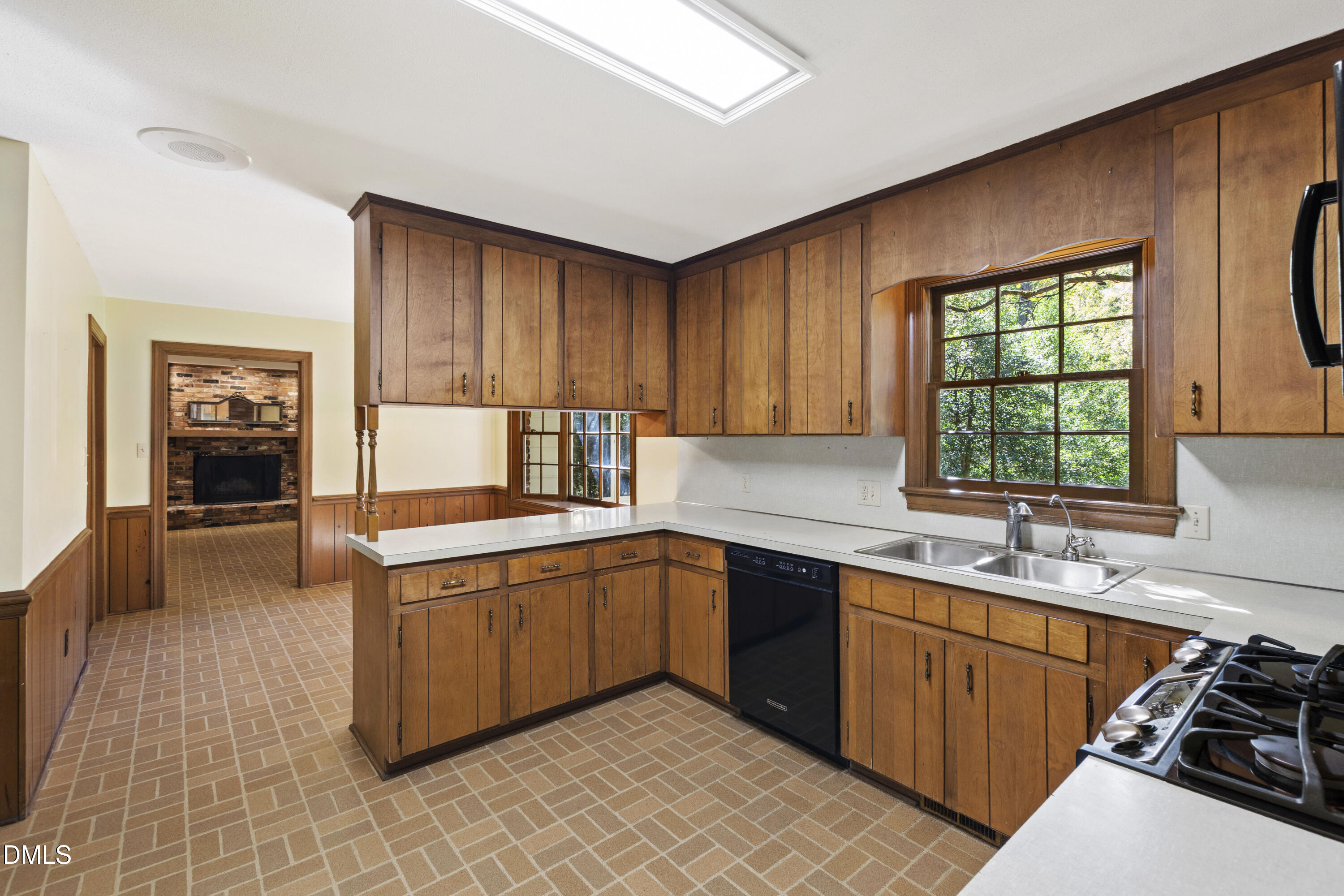 4208 Oak Park Road Raleigh, NC 27612 - Photo 15 of 66 a kitchen with a sink stove and cabinets