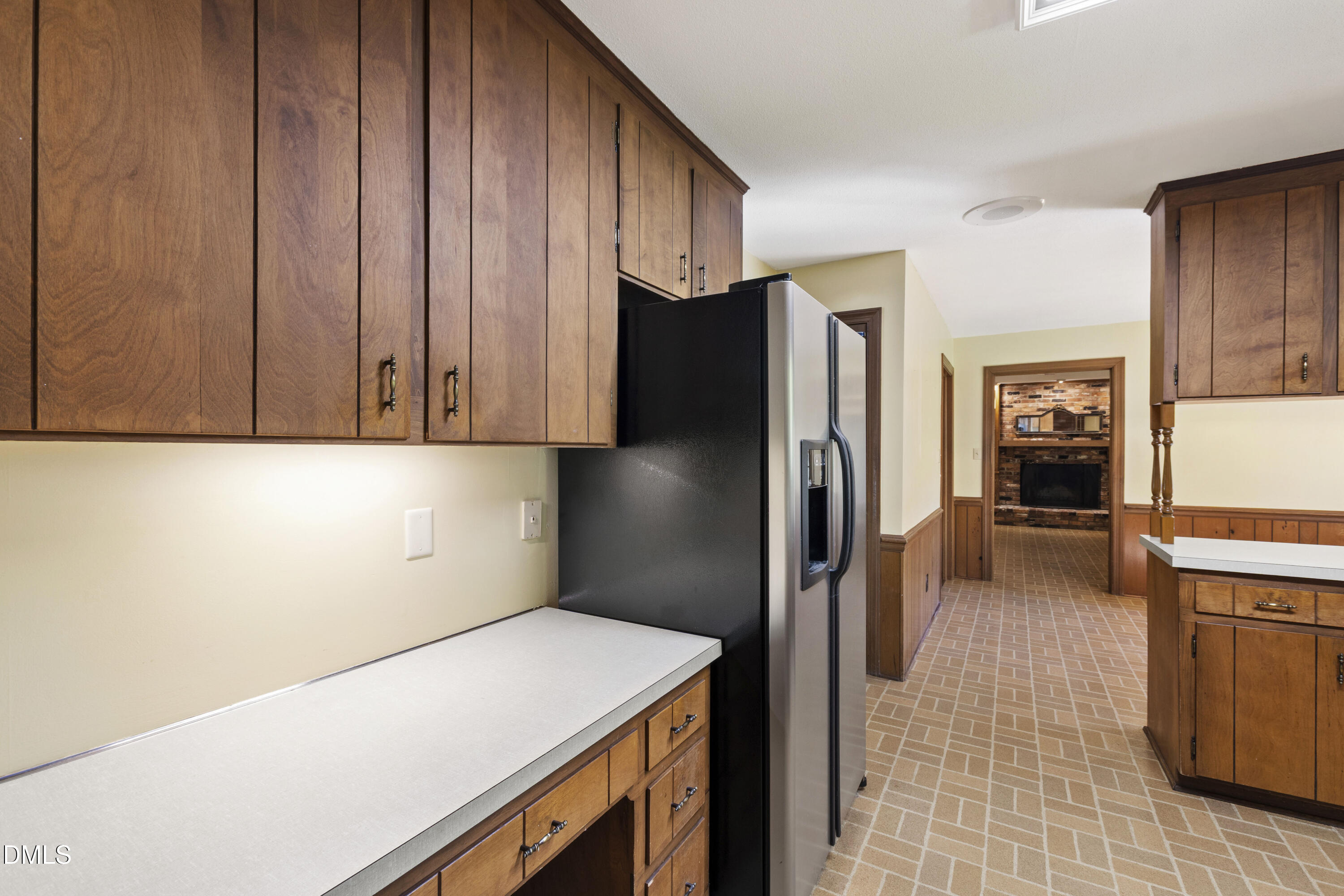 4208 Oak Park Road Raleigh, NC 27612 - Photo 16 of 66 a kitchen with a refrigerator and cabinets