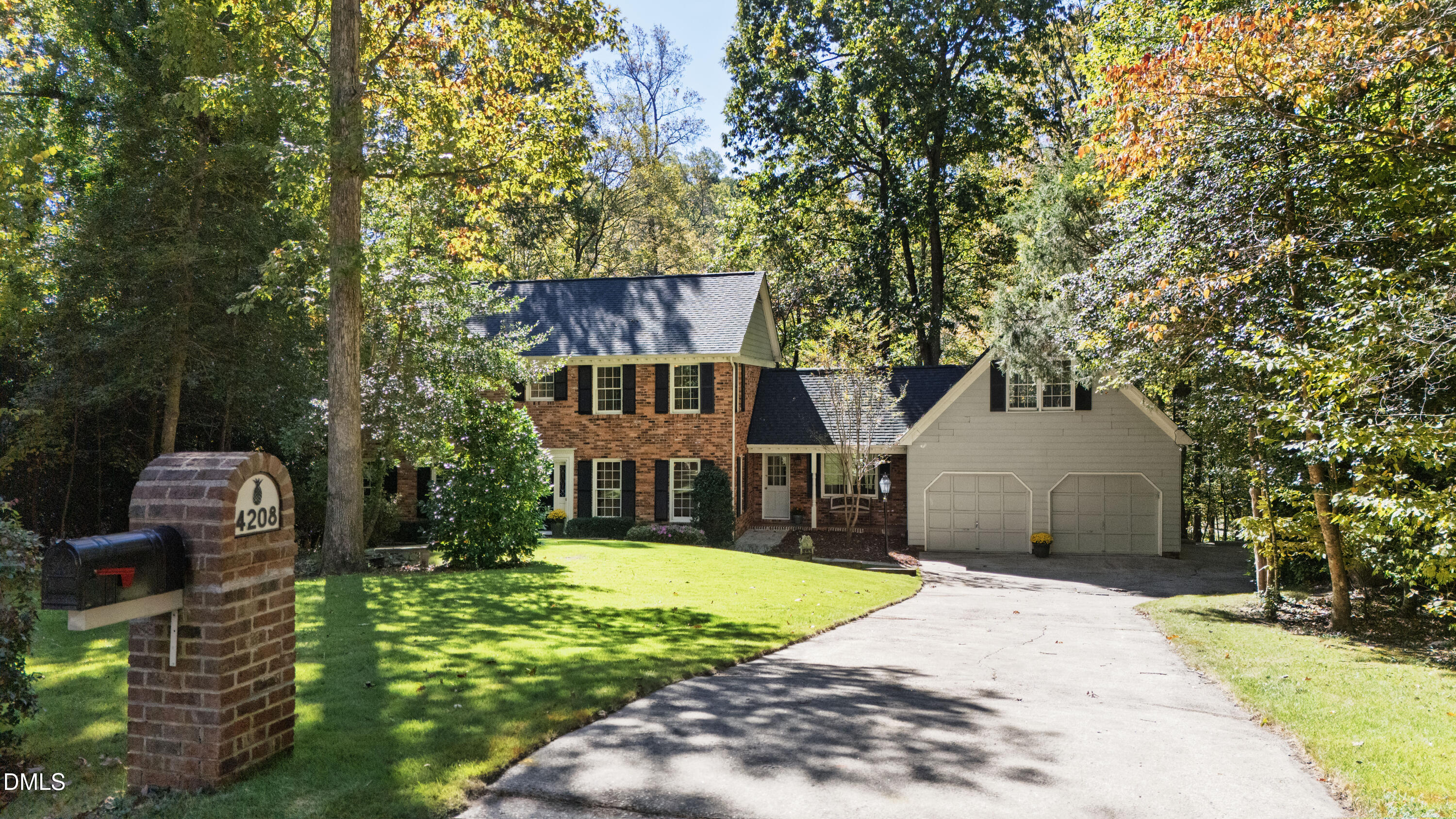 4208 Oak Park Road Raleigh, NC 27612 - Photo 2 of 66 a front view of a house with a garden