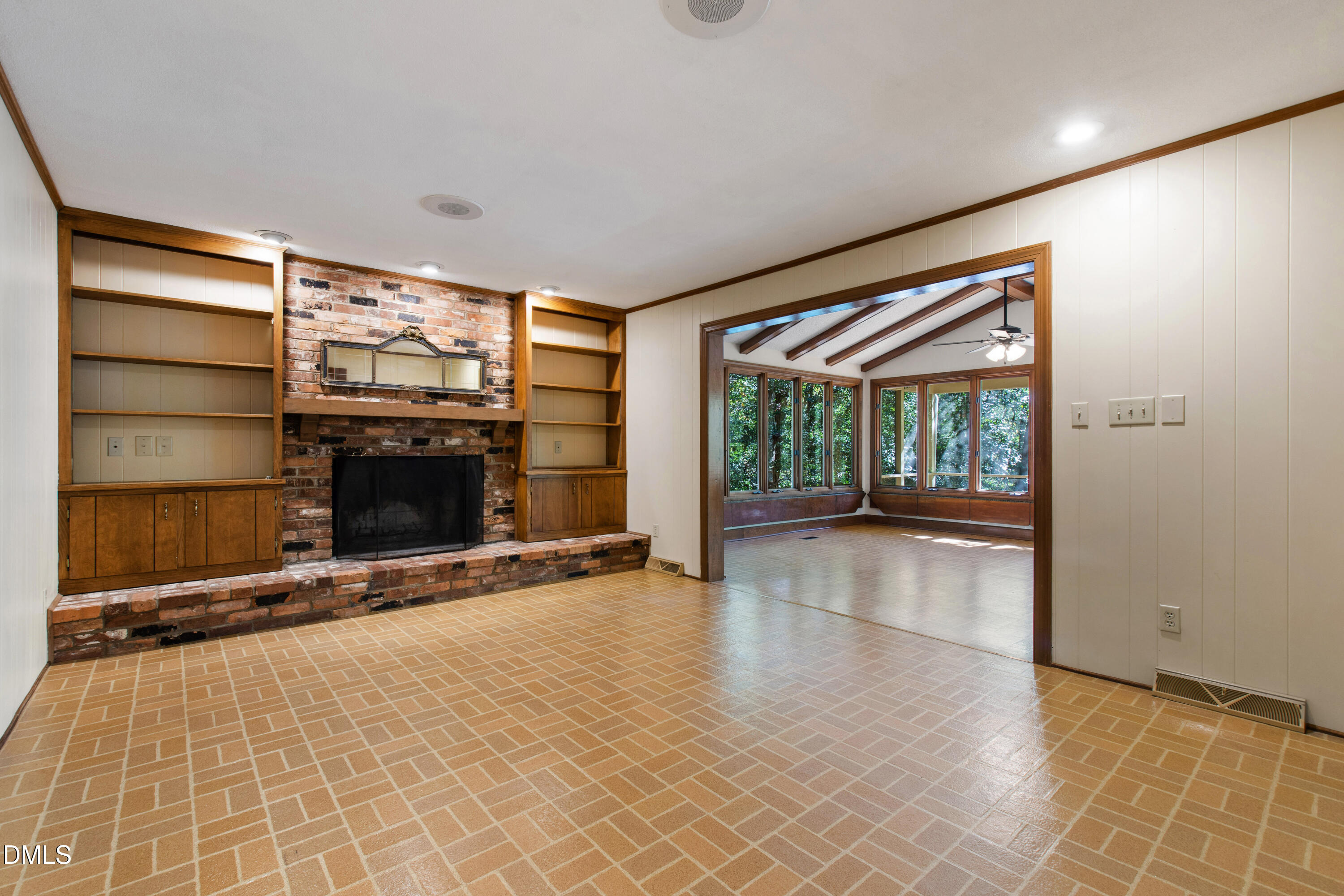 4208 Oak Park Road Raleigh, NC 27612 - Photo 22 of 66 a view of empty room with a fireplace and window