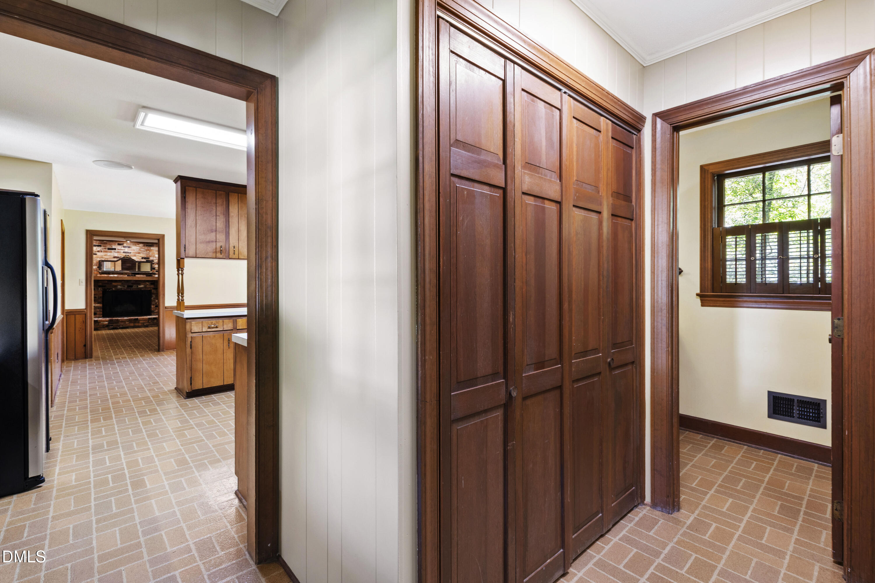 4208 Oak Park Road Raleigh, NC 27612 - Photo 27 of 66 a view of a hallway with wooden floor and a bathroom