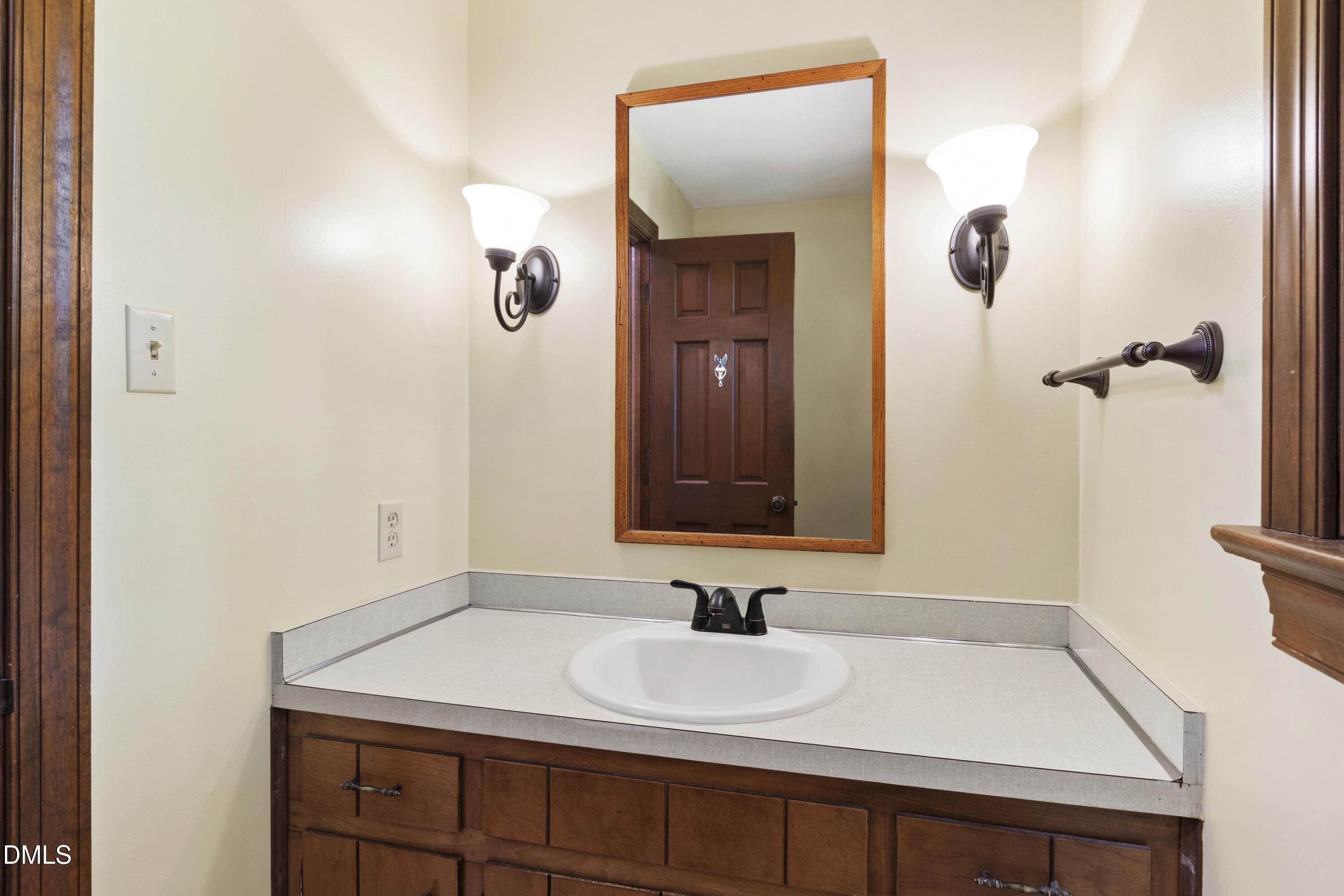 4208 Oak Park Road Raleigh, NC 27612 - Photo 28 of 66 a bathroom with a sink vanity and mirror