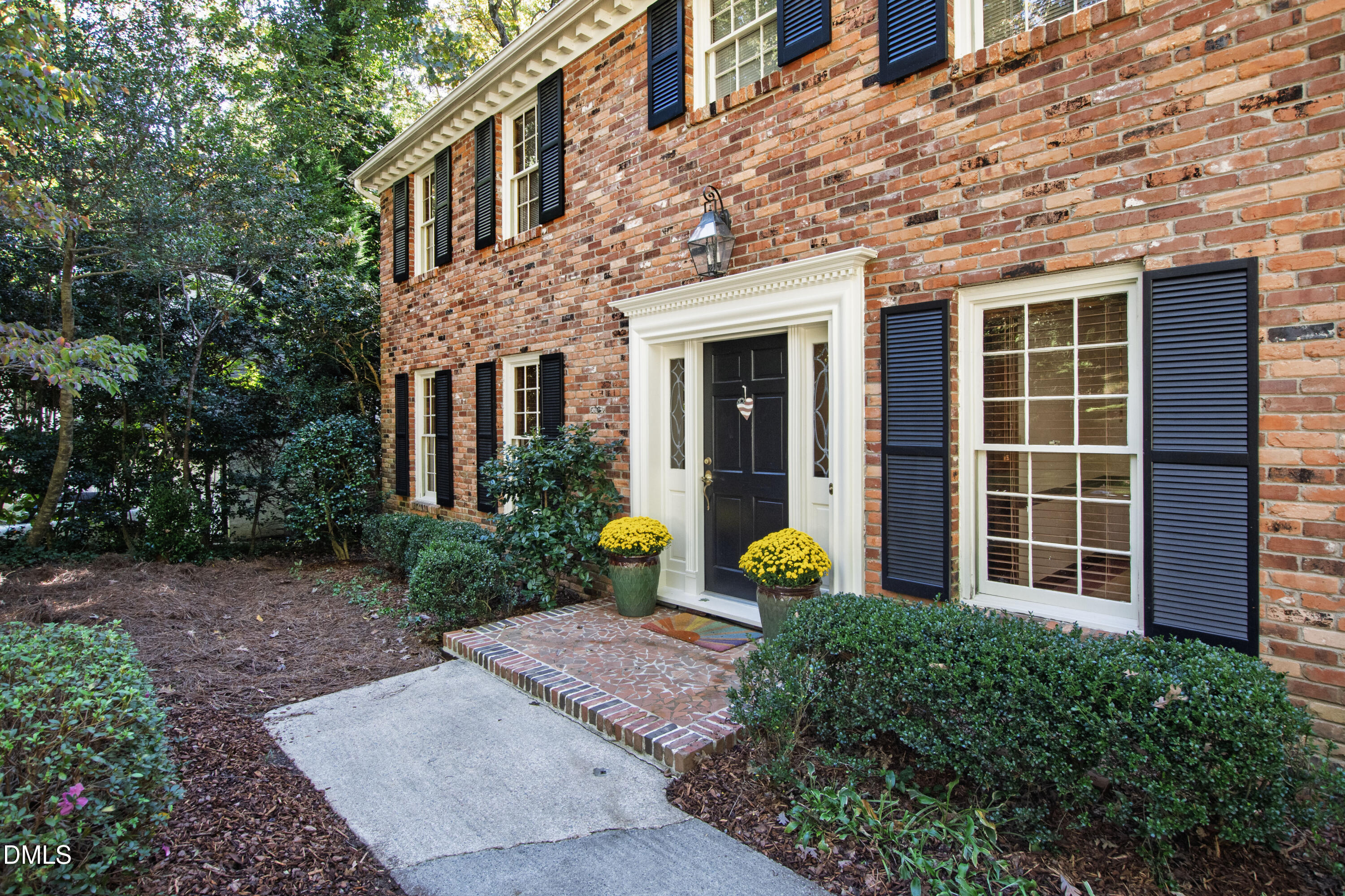 4208 Oak Park Road Raleigh, NC 27612 - Photo 3 of 66 a front view of a house with a garden