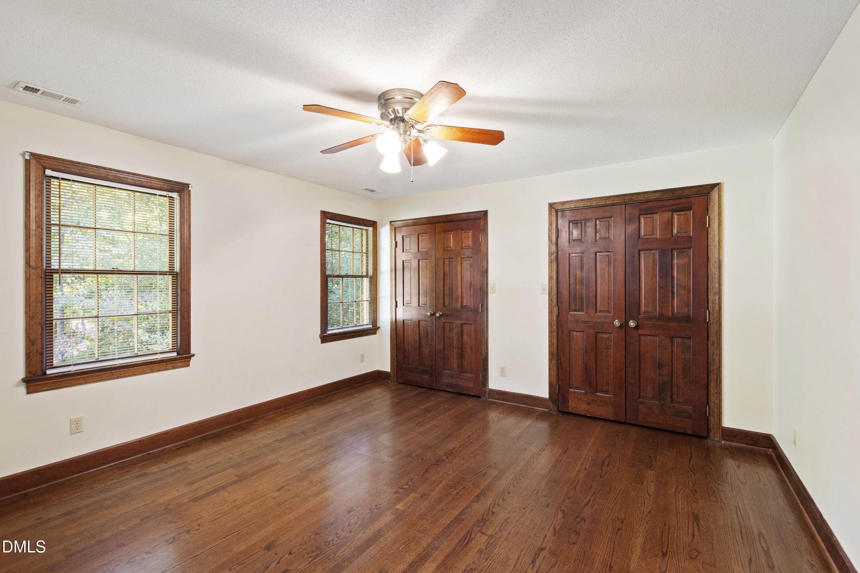 4208 Oak Park Road Raleigh, NC 27612 - Photo 38 of 66 a view of an empty room with wooden floor and a window
