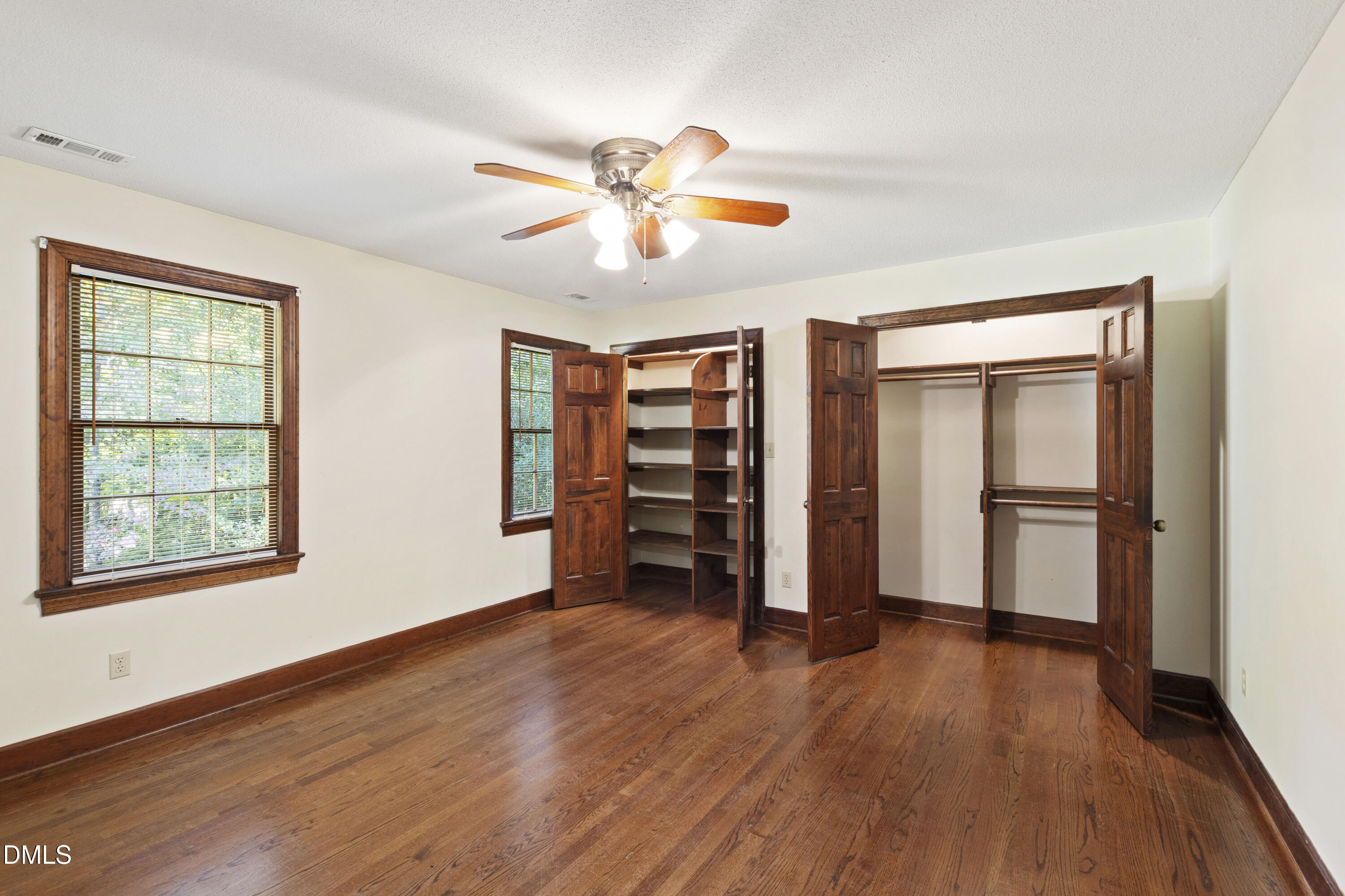 4208 Oak Park Road Raleigh, NC 27612 - Photo 39 of 66 a view of an empty room with a window and wooden floor