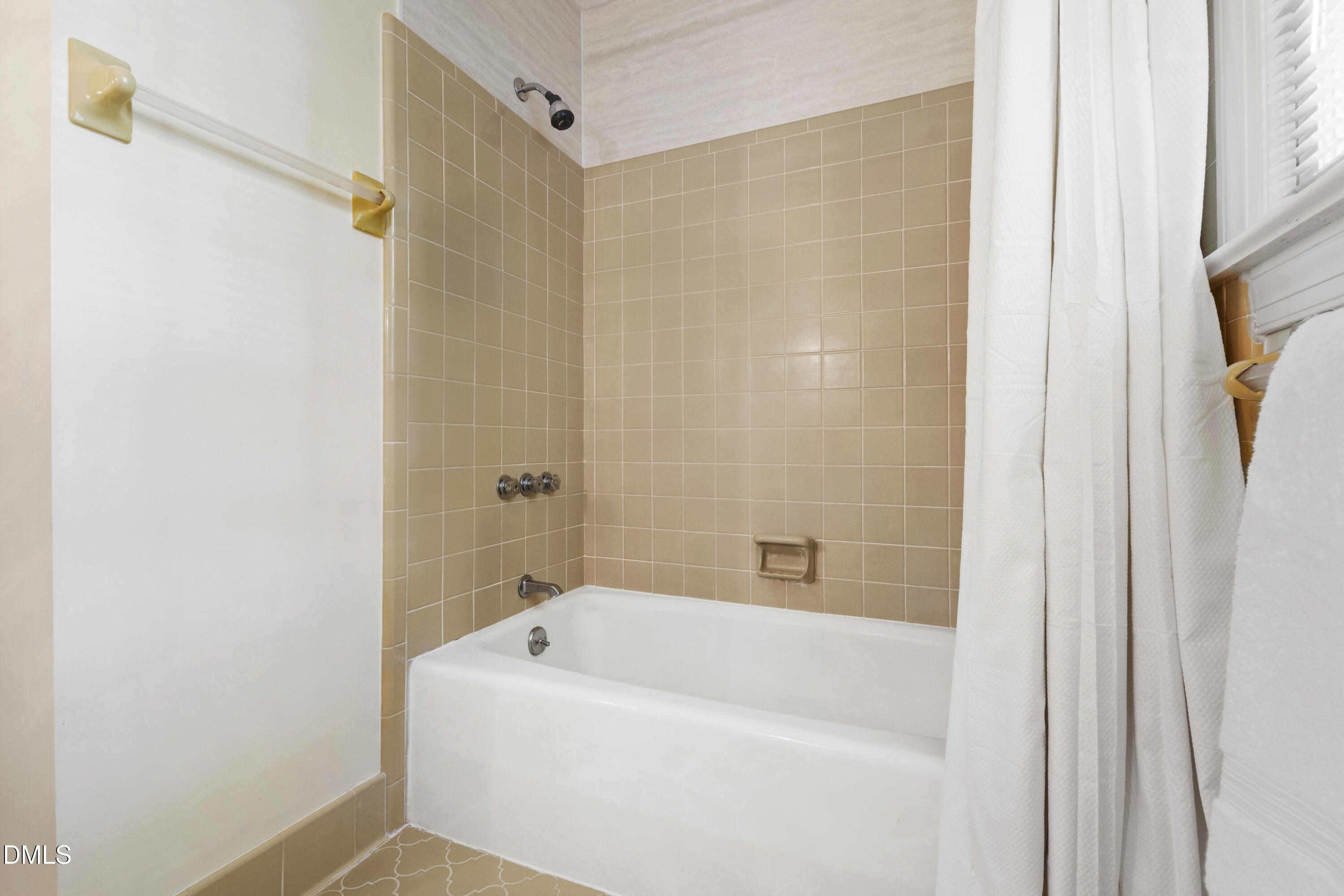 4208 Oak Park Road Raleigh, NC 27612 - Photo 42 of 66 a white bath tub sitting next to a white sink