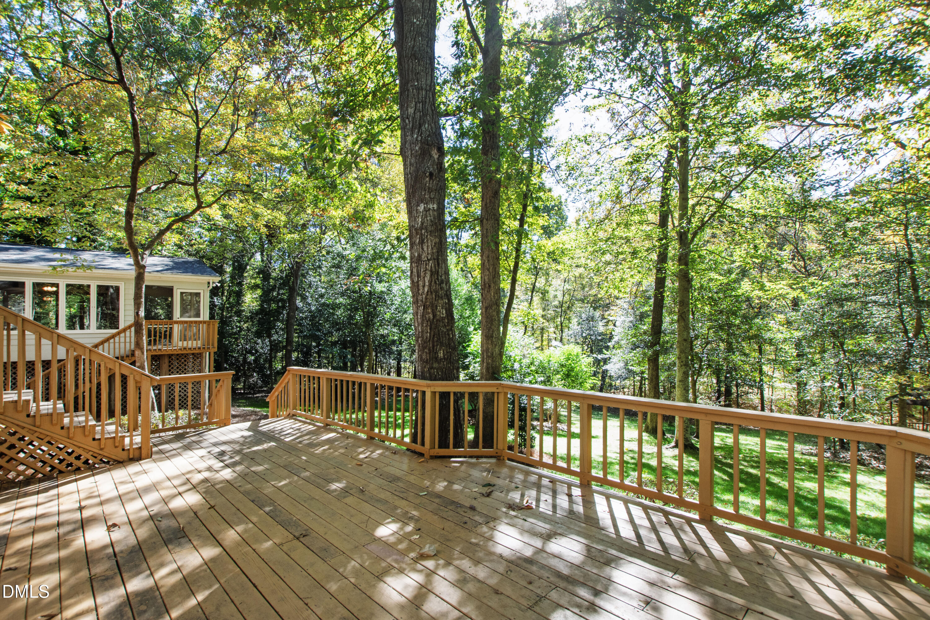 4208 Oak Park Road Raleigh, NC 27612 - Photo 53 of 66 a view of a house with backyard and deck