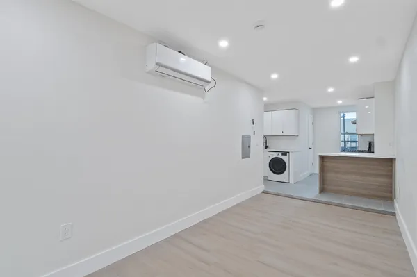 a view of kitchen with wooden floor