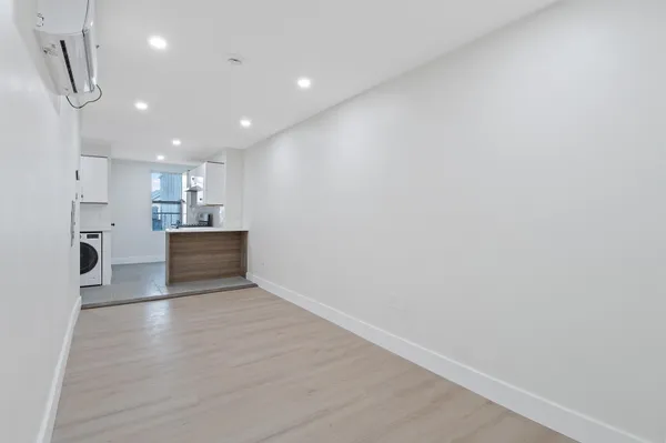 a view of kitchen with wooden floor