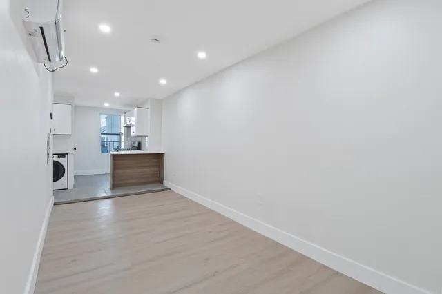 a view of kitchen with wooden floor