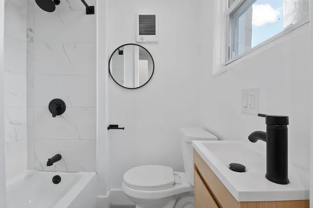 a view of a car parked in front of a building