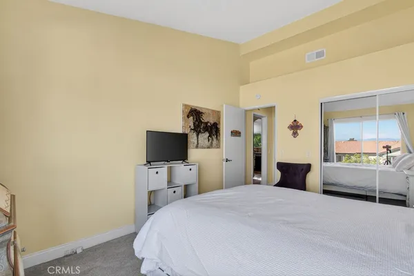 a bedroom with a bed and furniture