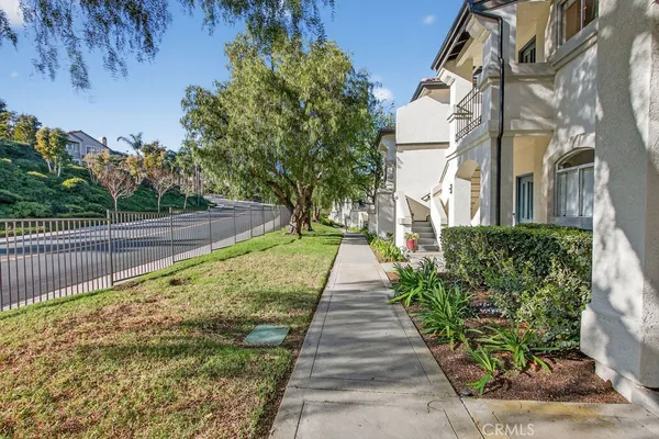 a view of a pathway with a yard