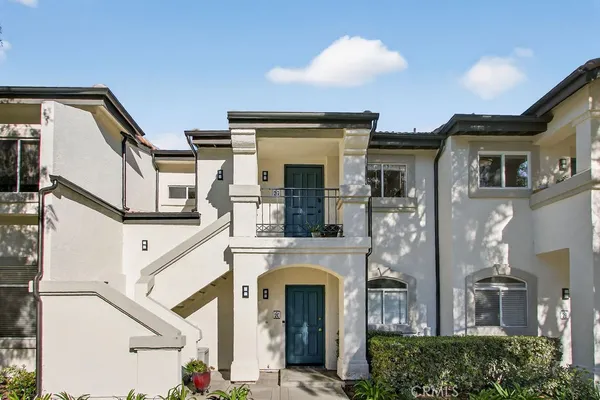 a view of a house with large windows