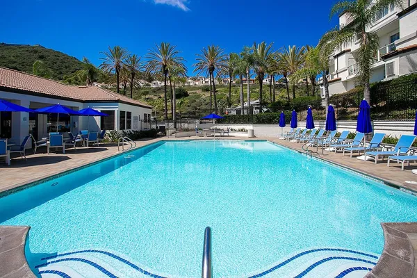a view of a swimming pool with a patio