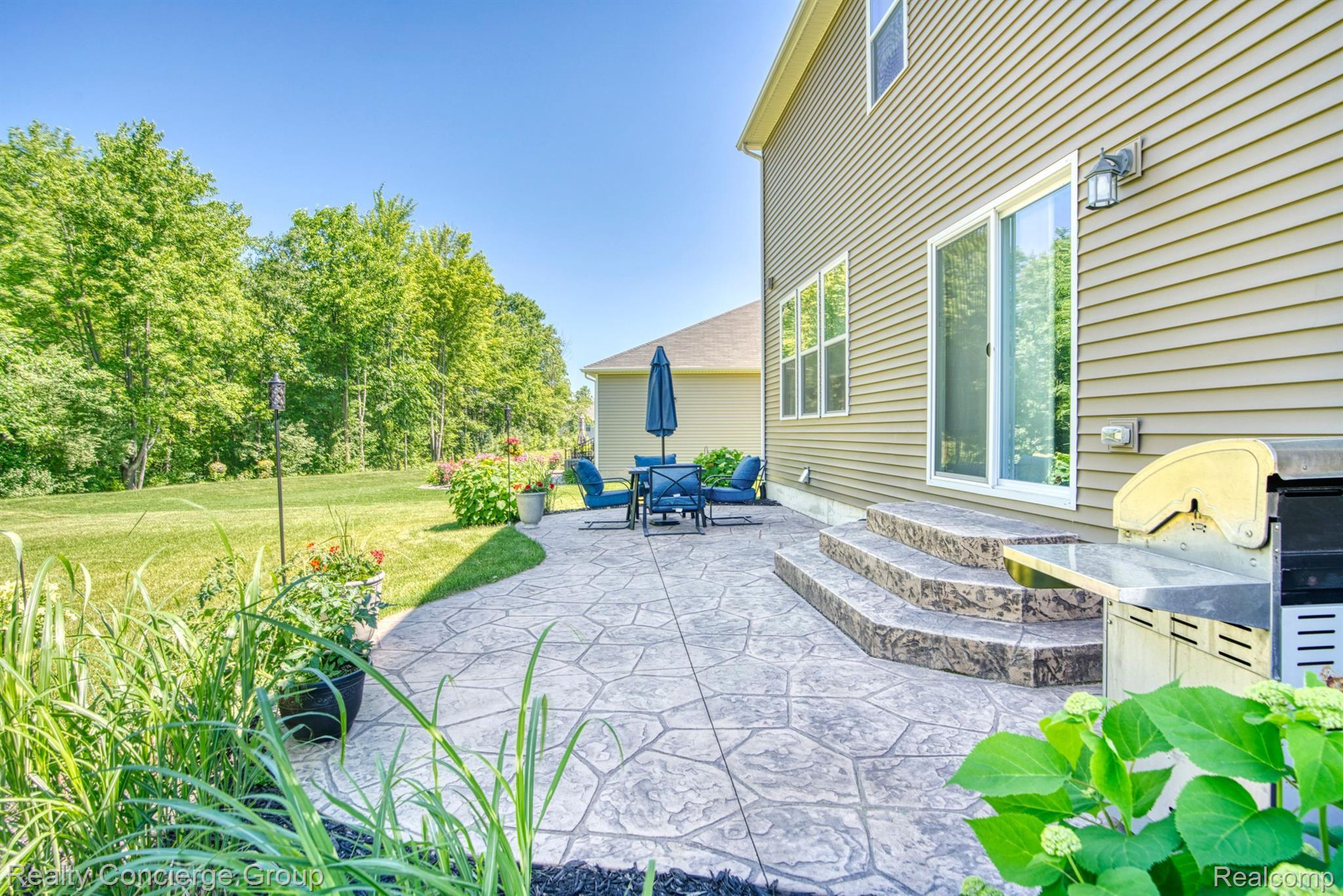 1171 Cannonade Loop Howell, MI 48843 - Photo 25 of 27 Enjoy days/nights grilling on the stamped patio