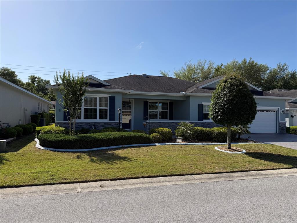 a front view of a house with a yard