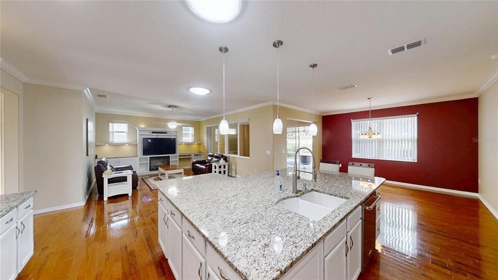 9273 Southwest 91st Ct Road Ocala, FL 34481 - Photo 12 of 38 a kitchen with counter top space and wooden floor