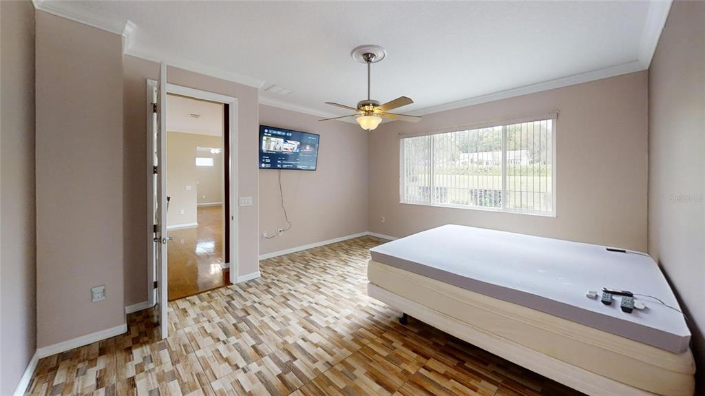 9273 Southwest 91st Ct Road Ocala, FL 34481 - Photo 21 of 38 a bedroom with a bed and a window