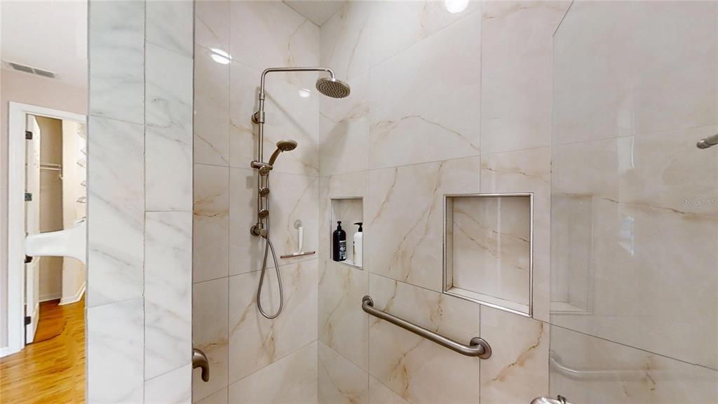 9273 Southwest 91st Ct Road Ocala, FL 34481 - Photo 24 of 38 a bathroom with a glass shower door