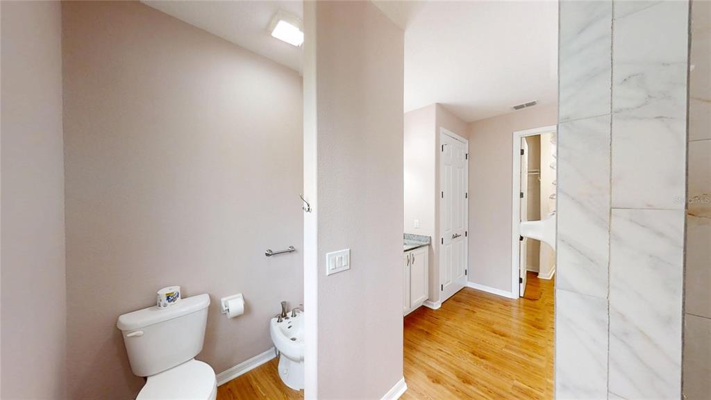 9273 Southwest 91st Ct Road Ocala, FL 34481 - Photo 25 of 38 a bathroom with a sink and toilet