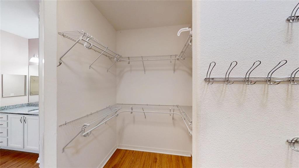 9273 Southwest 91st Ct Road Ocala, FL 34481 - Photo 26 of 38 a view of walk in closet with empty racks