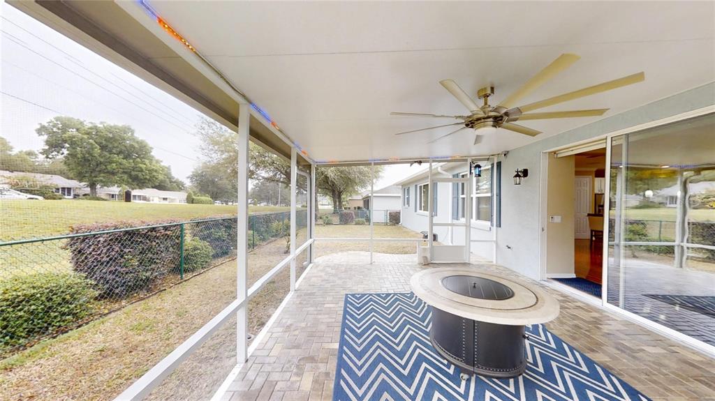 9273 Southwest 91st Ct Road Ocala, FL 34481 - Photo 34 of 38 a view of a porch with furniture and a yard