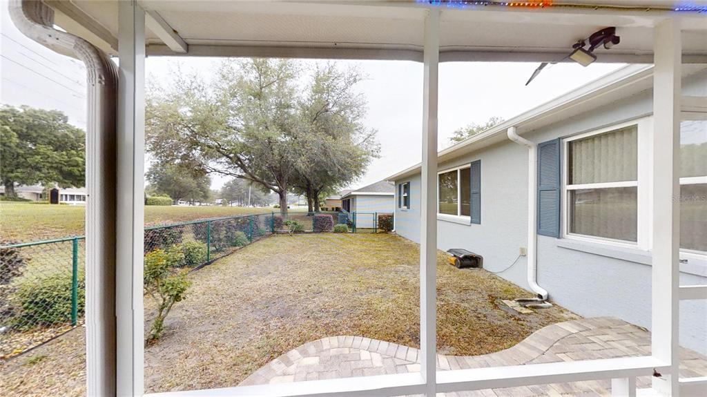 9273 Southwest 91st Ct Road Ocala, FL 34481 - Photo 35 of 38 a view of a patio in front of a house