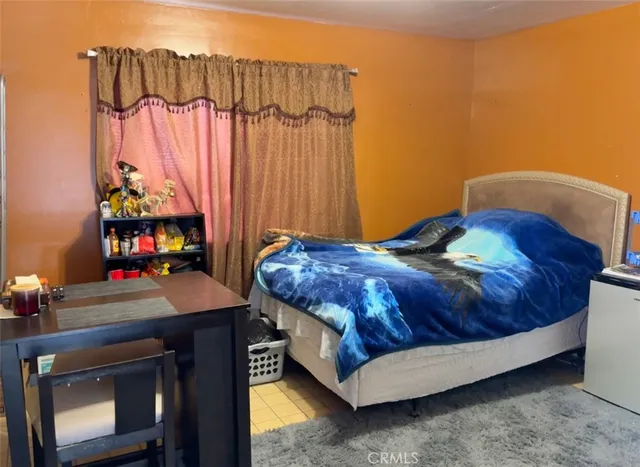a bedroom with a bed and a table in it