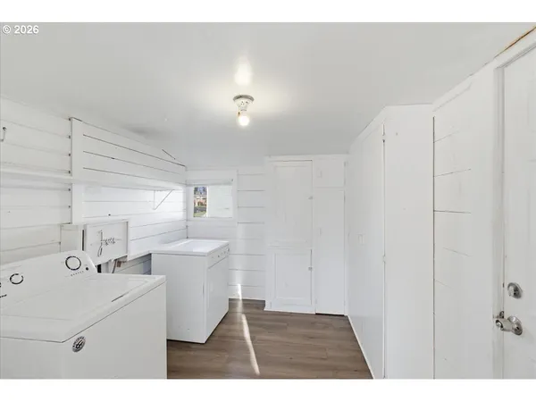 a kitchen with a sink and a refrigerator