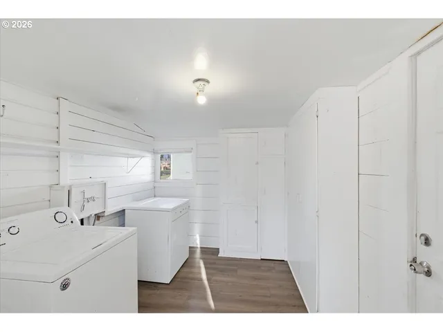 a kitchen with a sink and a refrigerator