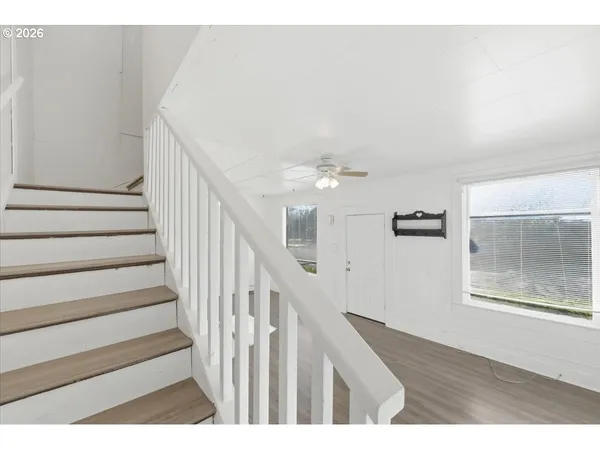 a view of entryway with wooden floor
