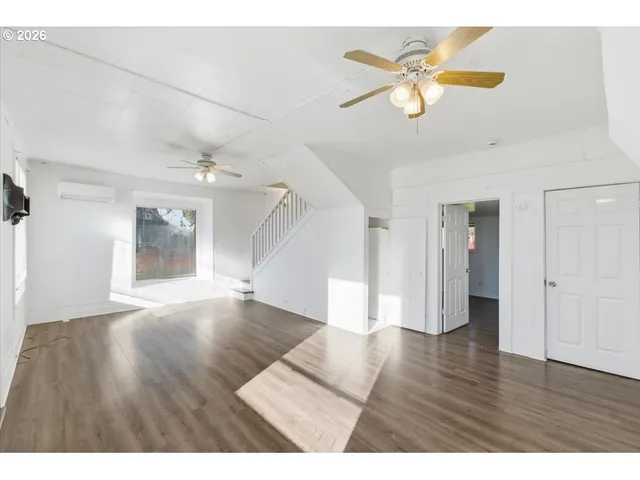 a view interior of a house wooden floor and an entryway