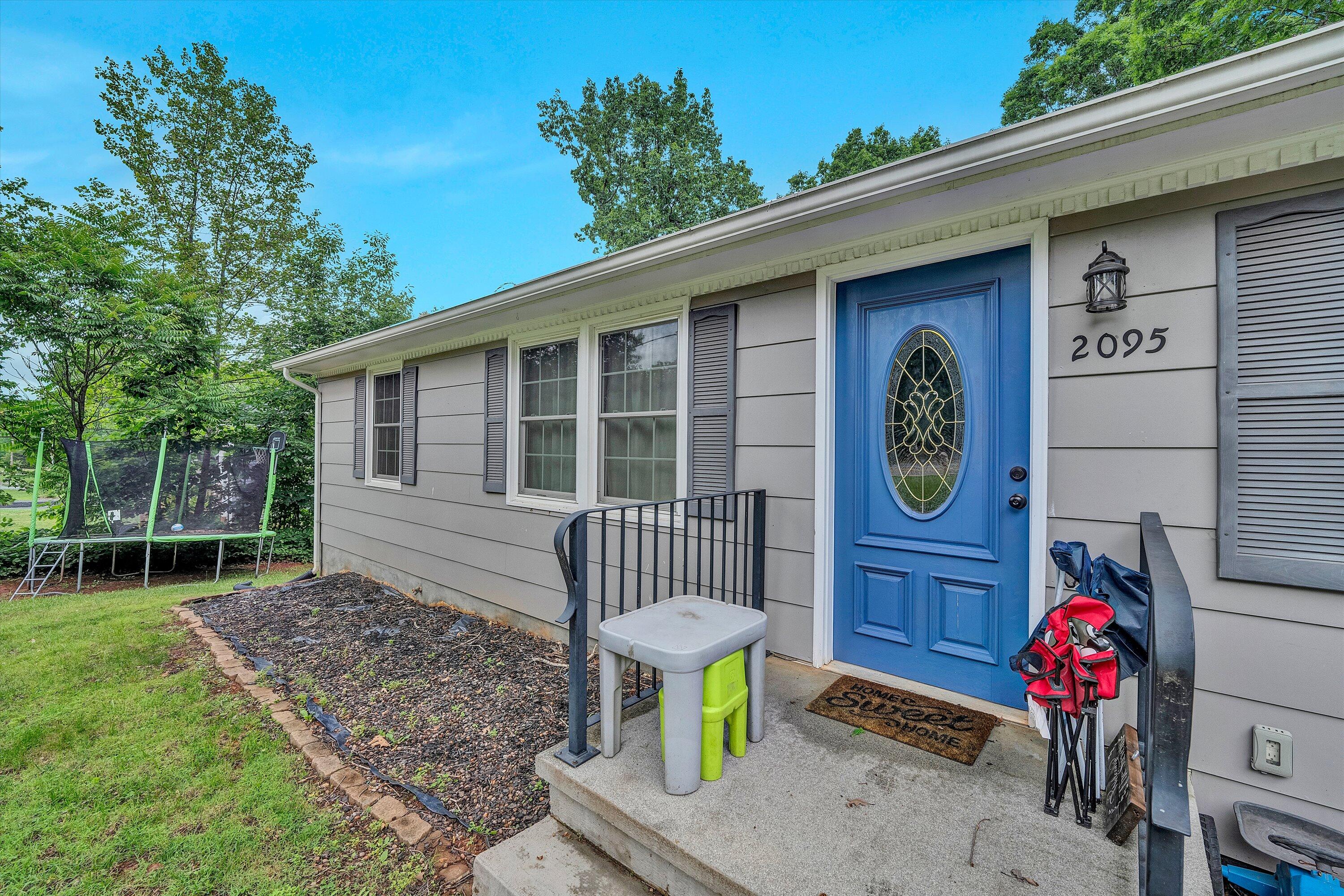2095 Webster Road Glade Hill, VA 24092 - Photo 20 of 20 a front view of a house with garden