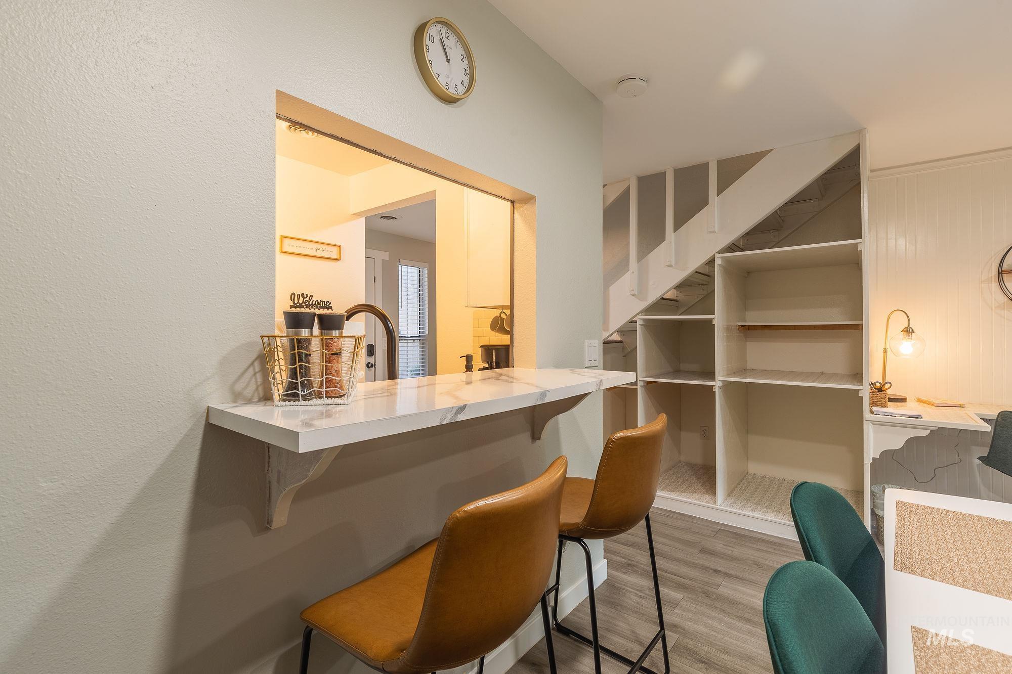 352 North Eagle Road Eagle, ID 83616 - Photo 12 of 44 Bar area with wood finished floors and stairway