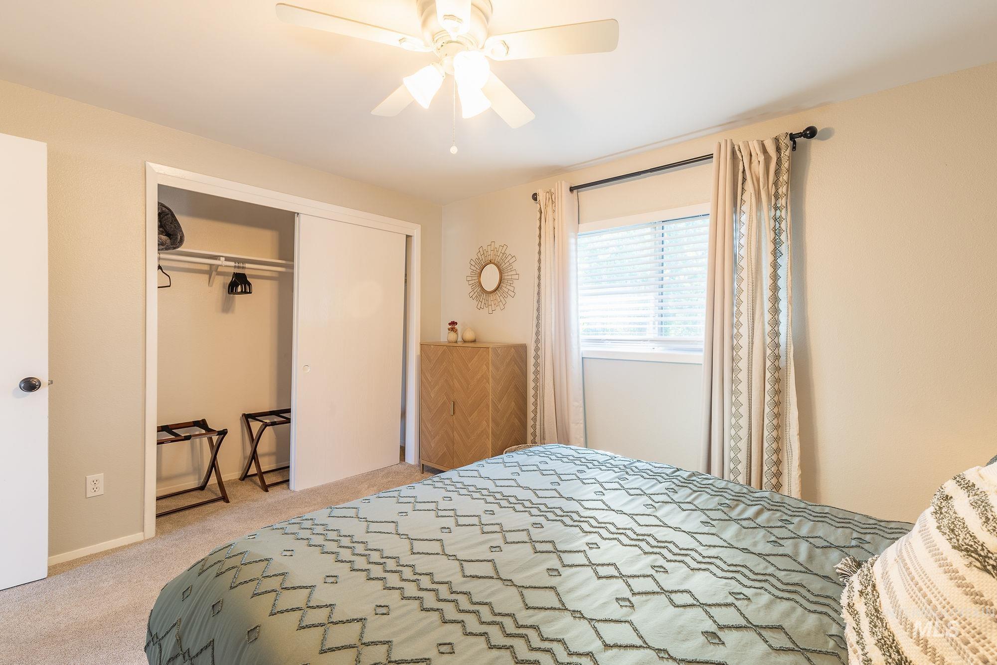 352 North Eagle Road Eagle, ID 83616 - Photo 27 of 44 Carpeted bedroom featuring a closet and a ceiling fan