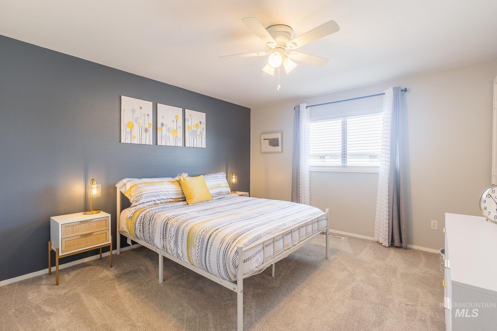 352 North Eagle Road Eagle, ID 83616 - Photo 31 of 44 Bedroom with light carpet and a ceiling fan