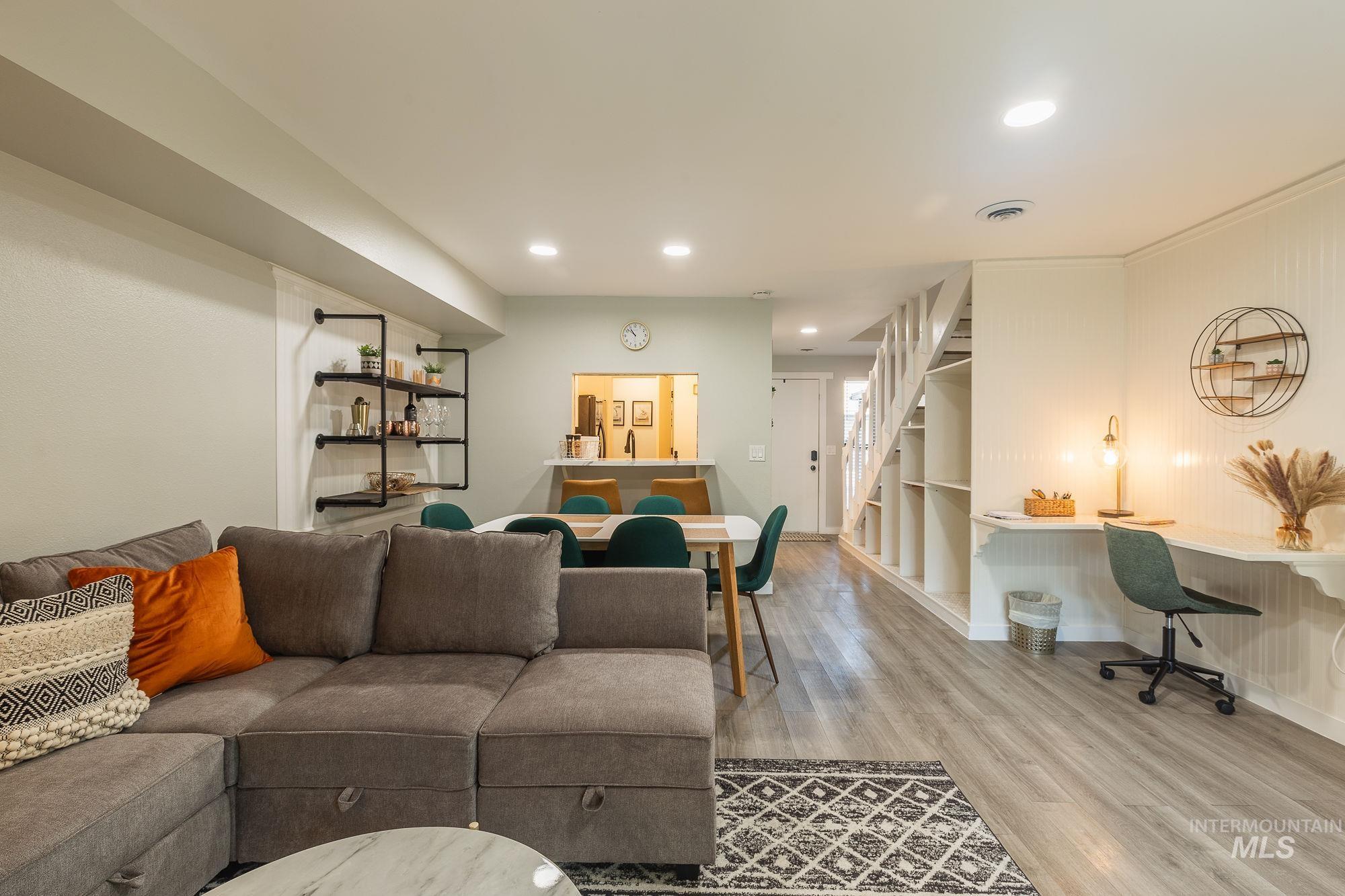 352 North Eagle Road Eagle, ID 83616 - Photo 5 of 44 Living area with wood finished floors, stairway, and recessed lighting