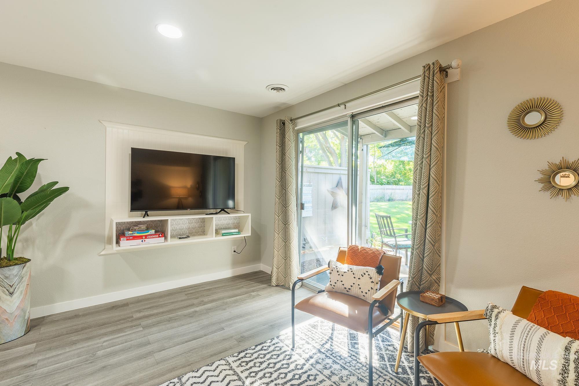 352 North Eagle Road Eagle, ID 83616 - Photo 6 of 44 Living area with wood finished floors and baseboards