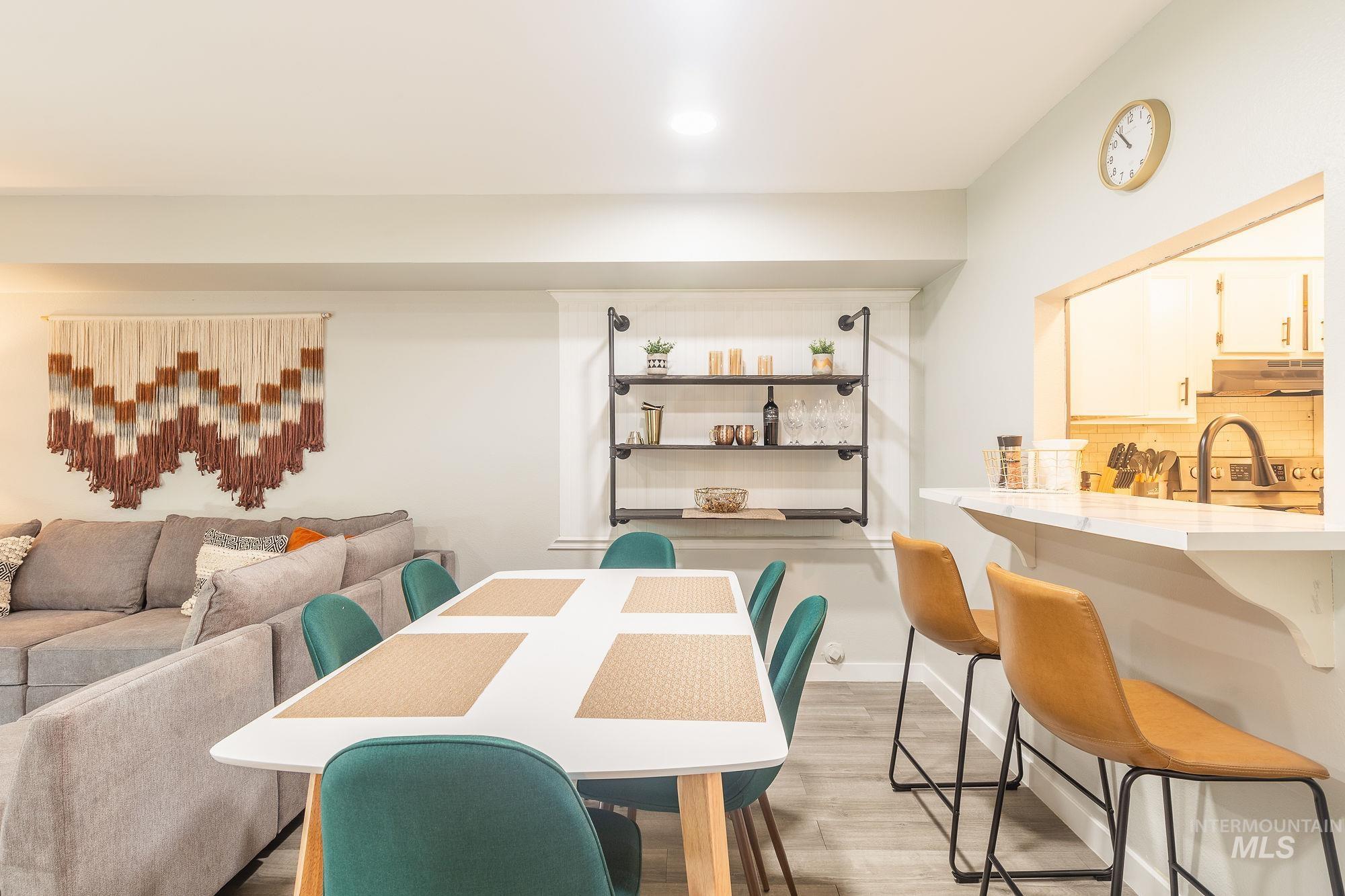 352 North Eagle Road Eagle, ID 83616 - Photo 8 of 44 Dining area with light wood-style flooring and recessed lighting