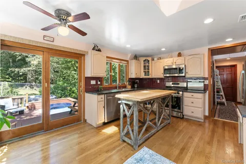 a kitchen with a stove a sink and a refrigerator