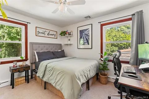 a bedroom with a bed and a desk