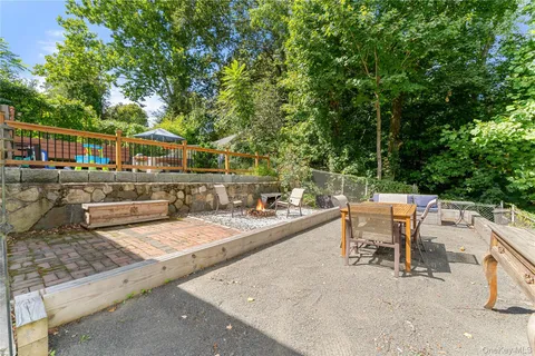 aerial view of a house with a yard and sitting area
