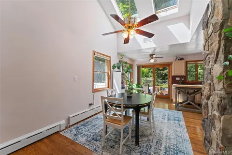 a dining room with a table and chairs