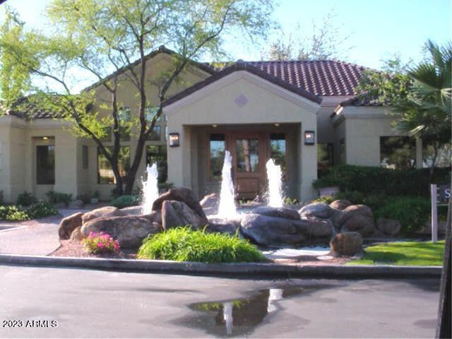 7575 East Indian Bend Road, Unit 1096 Scottsdale, AZ 85250 - Photo 3 of 3 a front view of a house with garden