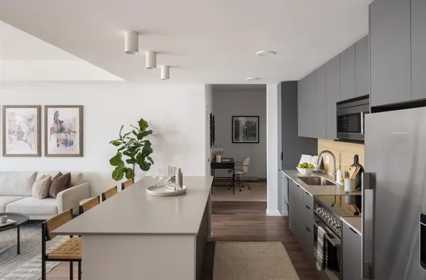 a dining room with furniture and chandelier