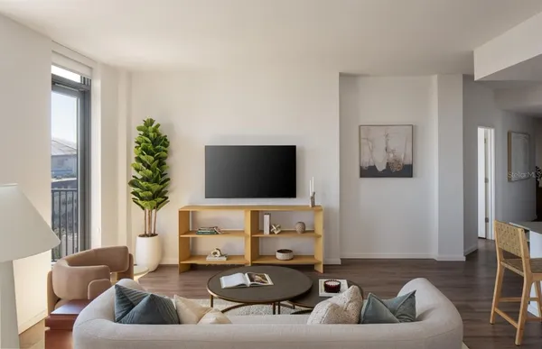 a living room with furniture and a flat screen tv