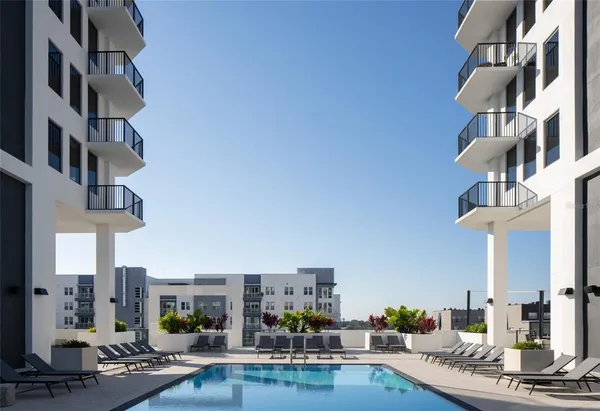 a view of living room with furniture and lamp