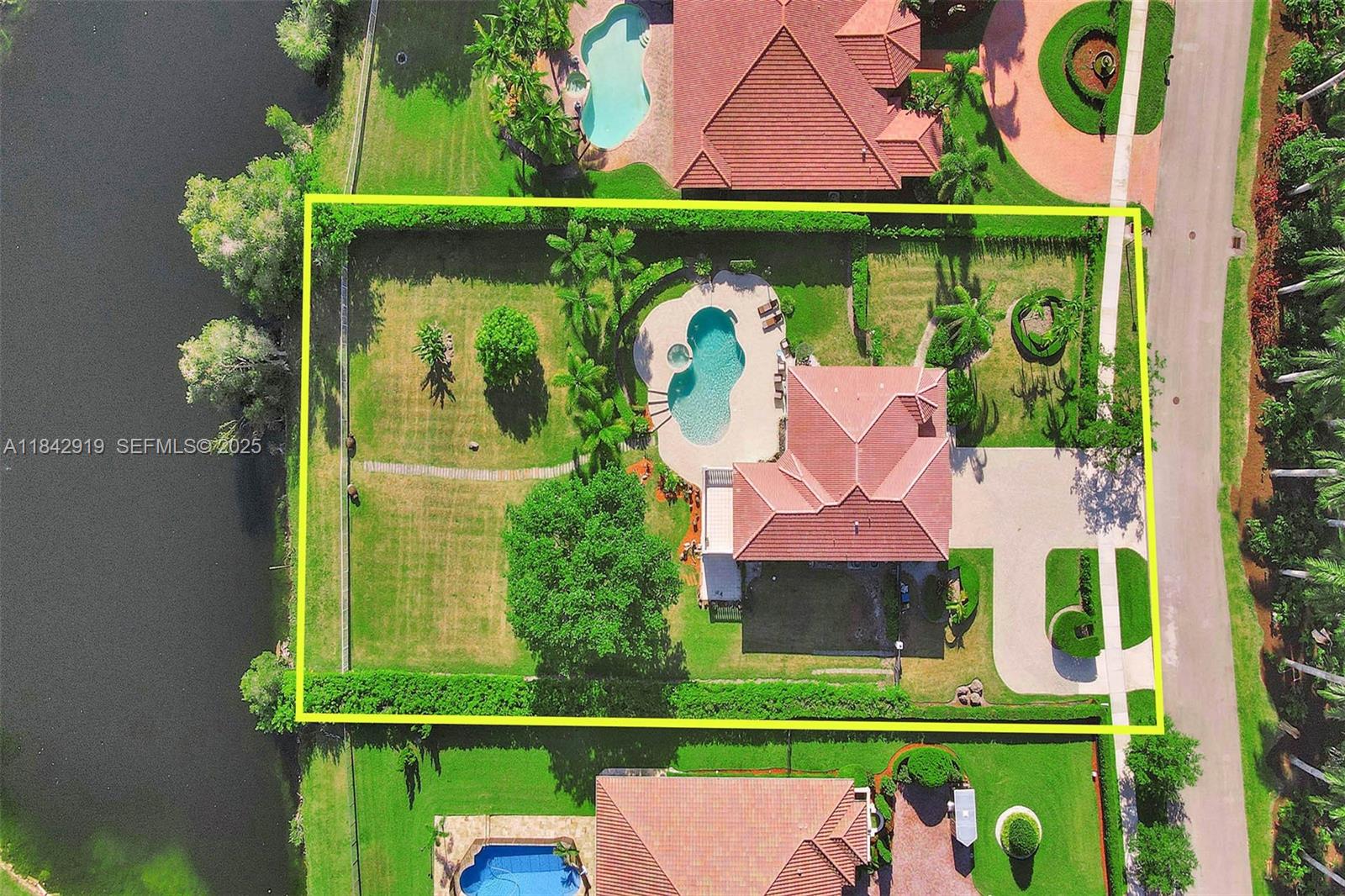 721 Ranch Road Weston, FL 33326 - Photo 8 of 38 a view of swimming pool with a yard